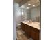 Double vanity bathroom with a large mirror and plenty of cabinet space at 26810 W Melinda Ln, Buckeye, AZ 85396