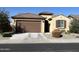 One-story house with brown garage door and desert landscaping at 26810 W Melinda Ln, Buckeye, AZ 85396