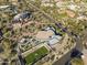 Aerial view of a modern home with a putting green and sports court at 3282 E Palo Verde Dr, Paradise Valley, AZ 85253
