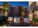 Outdoor fireplace and seating area in the backyard at 3282 E Palo Verde Dr, Paradise Valley, AZ 85253