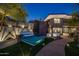 Backyard patio with fire pit and comfortable seating at 3282 E Palo Verde Dr, Paradise Valley, AZ 85253