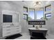Luxurious bathroom with freestanding tub, fireplace, and modern vanity at 3282 E Palo Verde Dr, Paradise Valley, AZ 85253