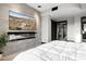 King-size bed with built in fireplace and TV at 3282 E Palo Verde Dr, Paradise Valley, AZ 85253