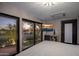Modern bedroom with large windows offering scenic views and a flat-screen TV at 3282 E Palo Verde Dr, Paradise Valley, AZ 85253