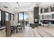 Open dining room with a glass table and modern chairs at 3282 E Palo Verde Dr, Paradise Valley, AZ 85253