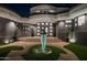 Modern entryway with a unique sculpture and well-lit steps at 3282 E Palo Verde Dr, Paradise Valley, AZ 85253