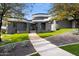 Contemporary home with a curved design and manicured landscaping at 3282 E Palo Verde Dr, Paradise Valley, AZ 85253
