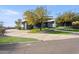 Modern home with a curved facade and a landscaped driveway at 3282 E Palo Verde Dr, Paradise Valley, AZ 85253