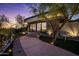 Landscaped pathway leading to a modern guesthouse with glass doors at 3282 E Palo Verde Dr, Paradise Valley, AZ 85253