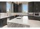 Modern kitchen with marble island and dark cabinetry at 3282 E Palo Verde Dr, Paradise Valley, AZ 85253