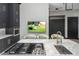 Modern kitchen island with cooktop and sink at 3282 E Palo Verde Dr, Paradise Valley, AZ 85253