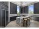 Modern kitchen with marble island and breakfast bar at 3282 E Palo Verde Dr, Paradise Valley, AZ 85253