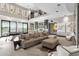 Spacious living area with sectional sofa, wet bar, and large windows at 3282 E Palo Verde Dr, Paradise Valley, AZ 85253