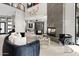 Modern living room with fireplace, stylish seating and large windows at 3282 E Palo Verde Dr, Paradise Valley, AZ 85253