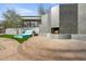 Outdoor fireplace with seating and landscaping at 3282 E Palo Verde Dr, Paradise Valley, AZ 85253