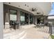 Covered patio with seating, ceiling fans, and heater at 3282 E Palo Verde Dr, Paradise Valley, AZ 85253