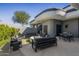 Modern patio furniture on a expansive concrete patio with lush landscaping at 3282 E Palo Verde Dr, Paradise Valley, AZ 85253