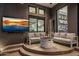 Covered patio with fire pit, comfortable seating, and large TV at 3282 E Palo Verde Dr, Paradise Valley, AZ 85253