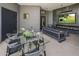 Outdoor patio area with seating, dining, and a fireplace at 3282 E Palo Verde Dr, Paradise Valley, AZ 85253