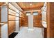 Spacious walk-in closet with custom built-ins and wood shelving at 3282 E Palo Verde Dr, Paradise Valley, AZ 85253