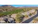 Aerial view of homes near golf course with mountain background at 33286 N 71St St, Scottsdale, AZ 85266