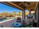 Inviting pool and patio area with seating and mountain backdrop at 33286 N 71St St, Scottsdale, AZ 85266