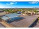 Aerial view of a property with a large home, covered parking, and storage shed at 37415 N 24Th St, Phoenix, AZ 85086