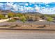 Stunning aerial view of a single-story home with a large yard and mountain views at 37415 N 24Th St, Phoenix, AZ 85086
