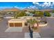 An aerial view of a house with a three-car garage and circular driveway at 37415 N 24Th St, Phoenix, AZ 85086