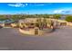 This aerial view shows a beautiful home with a large courtyard and gated entrance at 37415 N 24Th St, Phoenix, AZ 85086