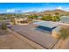 Aerial view showing a house with a large covered structure and fenced area at 37415 N 24Th St, Phoenix, AZ 85086