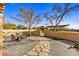 Landscaped backyard with a firepit and stone pathway at 37415 N 24Th St, Phoenix, AZ 85086