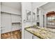 Vanity with granite countertop and a large closet at 37415 N 24Th St, Phoenix, AZ 85086