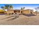 Spanish style home with attractive landscaping and a large gravel driveway at 37415 N 24Th St, Phoenix, AZ 85086