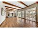 Living room with hardwood floors, stone fireplace and large windows at 37415 N 24Th St, Phoenix, AZ 85086