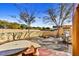 Outdoor seating area with fire pit and desert landscape at 37415 N 24Th St, Phoenix, AZ 85086