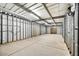 Large unfinished workshop with metal walls and concrete floor at 37415 N 24Th St, Phoenix, AZ 85086