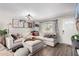 Bright living room featuring a sectional sofa and eclectic decor at 4055 E Hearn Rd, Phoenix, AZ 85032