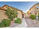 House exterior with two-car garage and desert landscaping at 45061 W Alamendras St, Maricopa, AZ 85139