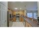 Kitchen with stainless steel appliances and oak cabinets at 45061 W Alamendras St, Maricopa, AZ 85139