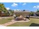 Circular firepit with brick patio and seating at 4524 E Walatowa St, Phoenix, AZ 85044