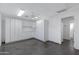 Bright white kitchen with ample cabinet space and concrete floor at 4524 E Walatowa St, Phoenix, AZ 85044