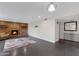 Living room with a brick fireplace and built-in shelves at 4524 E Walatowa St, Phoenix, AZ 85044