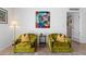 Living area with two green armchairs and a side table at 4600 N 68Th St # 370, Scottsdale, AZ 85251