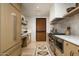 Contemporary kitchen featuring stainless steel appliances, light wood cabinets, and modern design at 4849 N Camelback Ridge Dr # A101, Scottsdale, AZ 85251