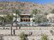 Community pool with poolhouse, mountain views, lounge chairs and privacy fence at 4849 N Camelback Ridge Dr # A101, Scottsdale, AZ 85251