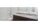 Well-lit bathroom features a double granite vanity and tub-shower combo at 5087 E Umber Rd, San Tan Valley, AZ 85143
