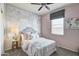Cozy bedroom with a world map mural and ceiling fan at 5087 E Umber Rd, San Tan Valley, AZ 85143