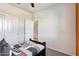 Small bedroom with twin bed and built-in closet at 5087 E Umber Rd, San Tan Valley, AZ 85143