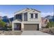 Two-story house with a brown garage door and mountain views at 5087 E Umber Rd, San Tan Valley, AZ 85143